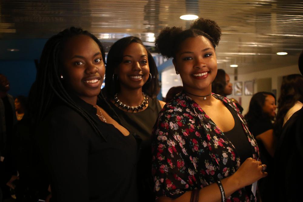 Image 1 of 30 black student graduates posing for photos